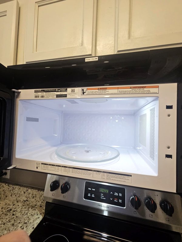 Microwave interior checked and clean